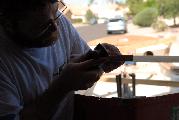 Using a block plane to trim the fit of the rails on the bow.